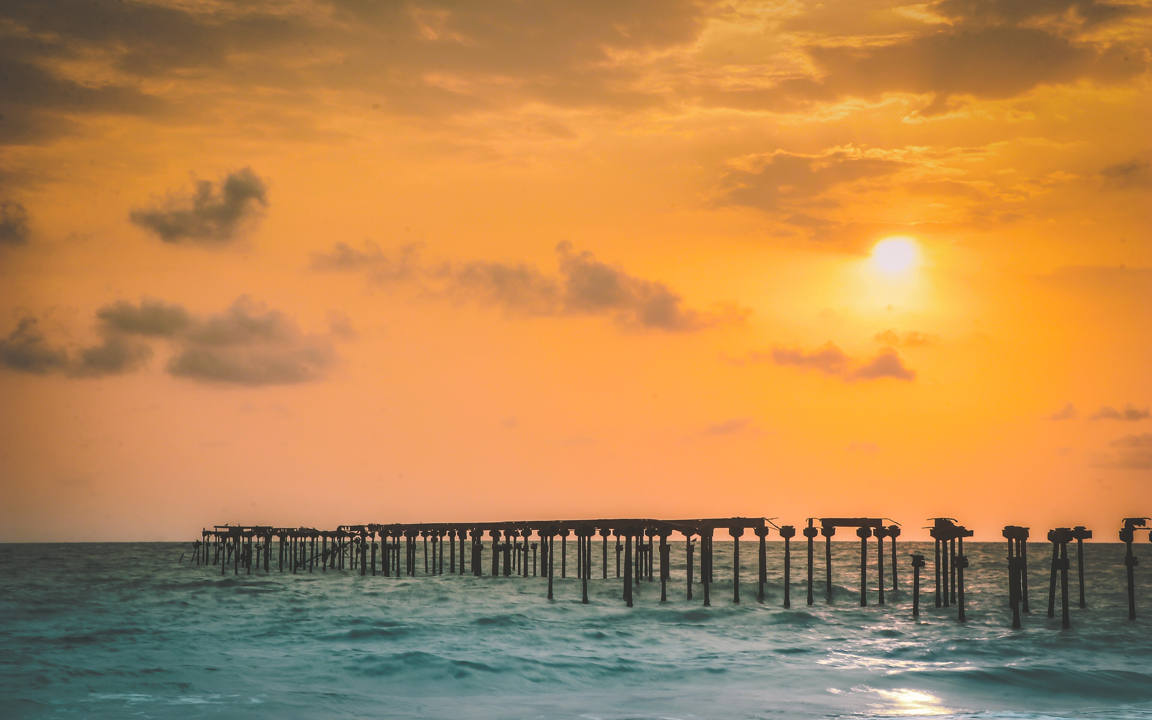 Historic pier and coastline at Alleppey Beach