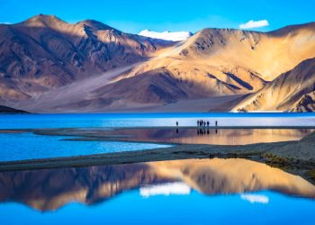 Landscape with reflections of the mountains on the lake named Pangong Tso, situated around Leh, Ladakh, India.