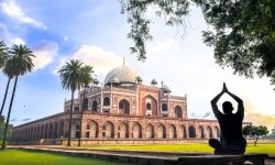 A man doing Yoga on the lawns of Humayun’s Tomb during the Early morning.